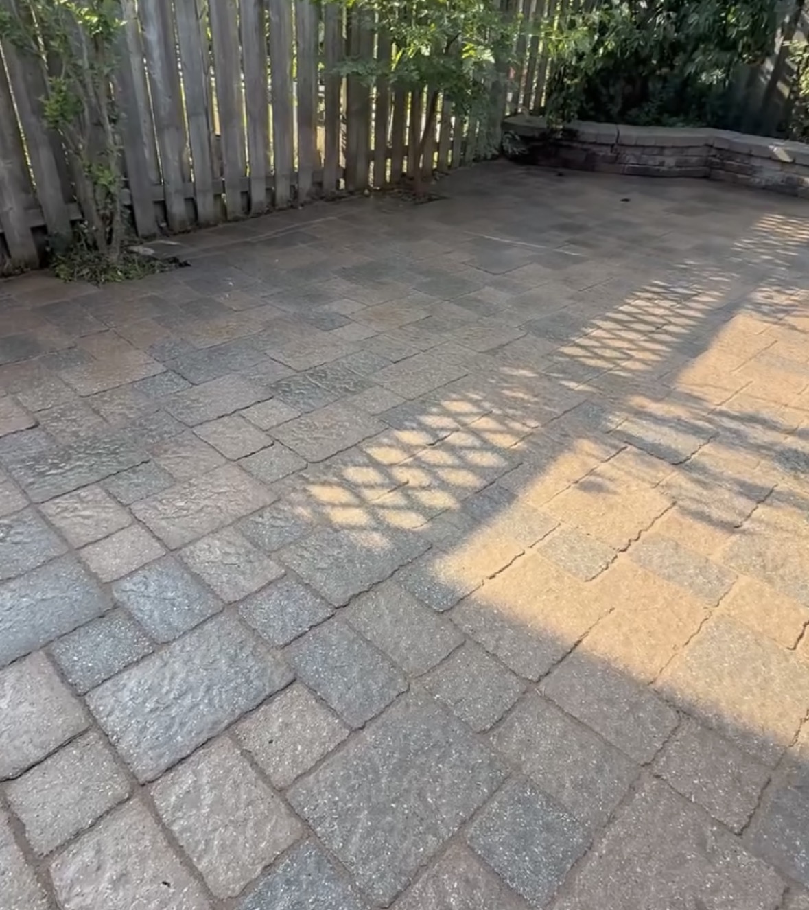 The same interlock patio after cleaning, weed removal, sanding and sealing